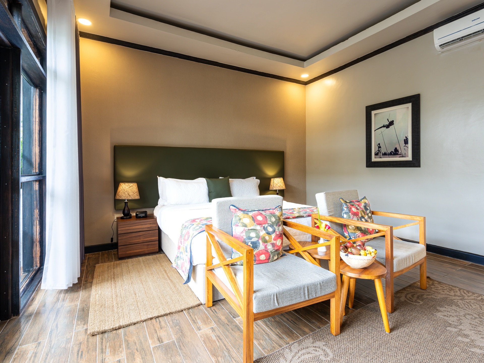 A lodge bedroom with a view towards the Virunga volcanoes, Rwanda